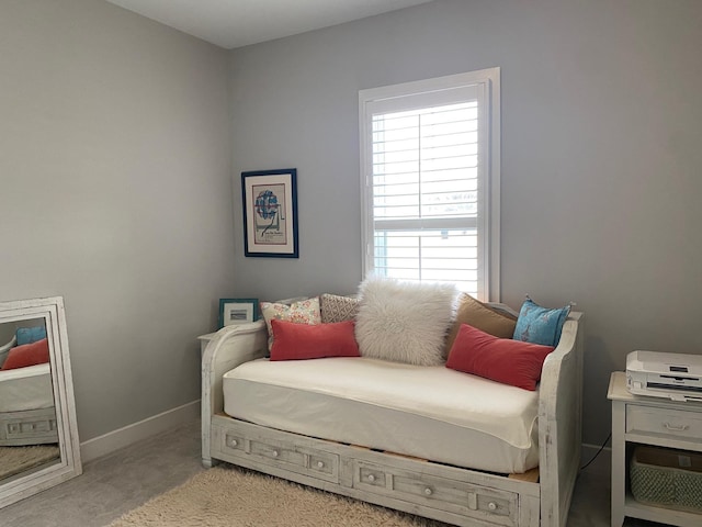 carpeted bedroom featuring baseboards