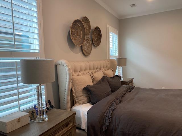 bedroom featuring visible vents