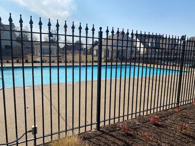 community pool featuring fence