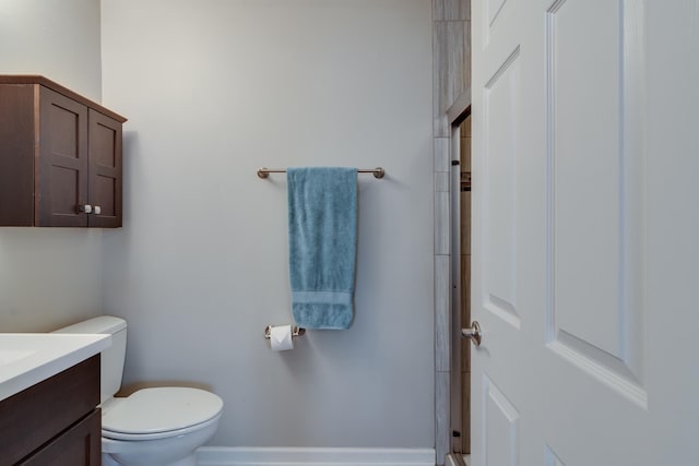 full bath featuring toilet, vanity, and walk in shower