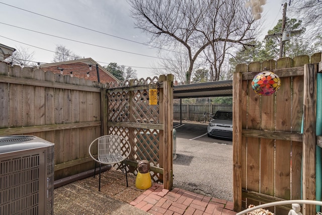 view of patio featuring cooling unit and fence