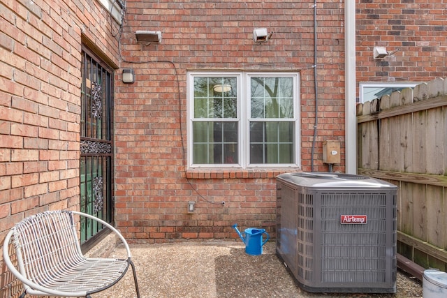 view of patio / terrace with fence and central AC