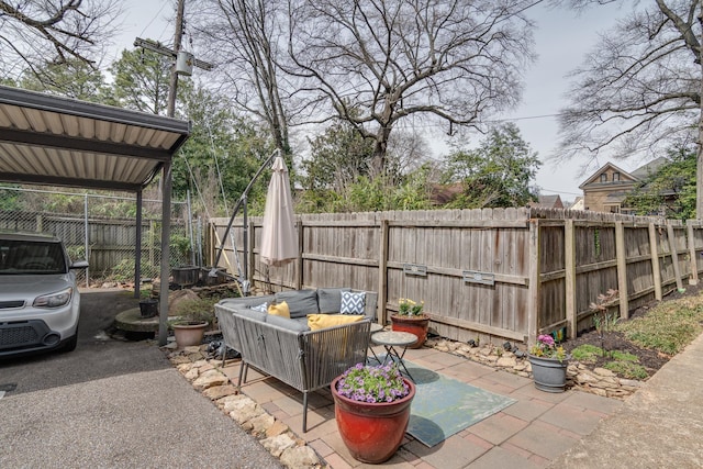 view of patio featuring a fenced backyard and outdoor lounge area