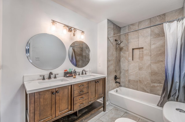 bathroom featuring a sink, toilet, shower / bath combo, and tile patterned floors
