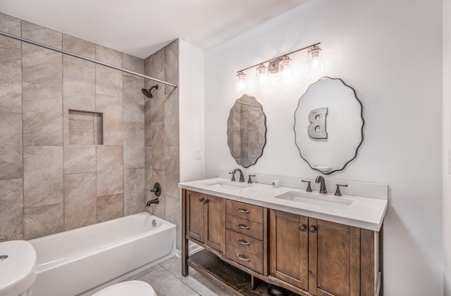 bathroom with bathing tub / shower combination, toilet, double vanity, and a sink