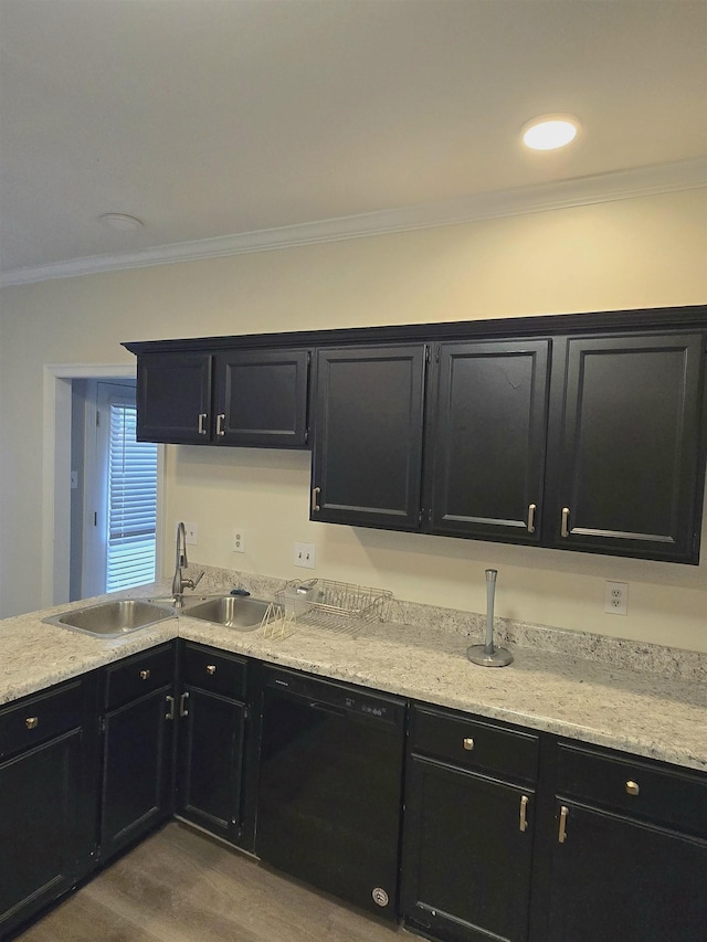 kitchen featuring crown molding, wood finished floors, black dishwasher, dark cabinetry, and a sink