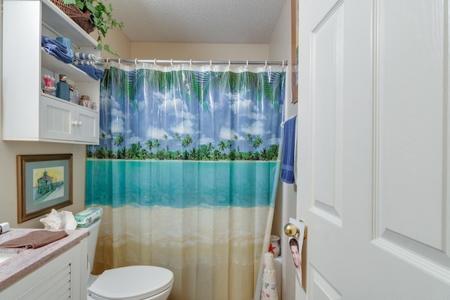 9995 Woodland Birch Dr, Lakeland, TN 38002 - bathroom featuring curtained shower, a textured ceiling, vanity, and toilet