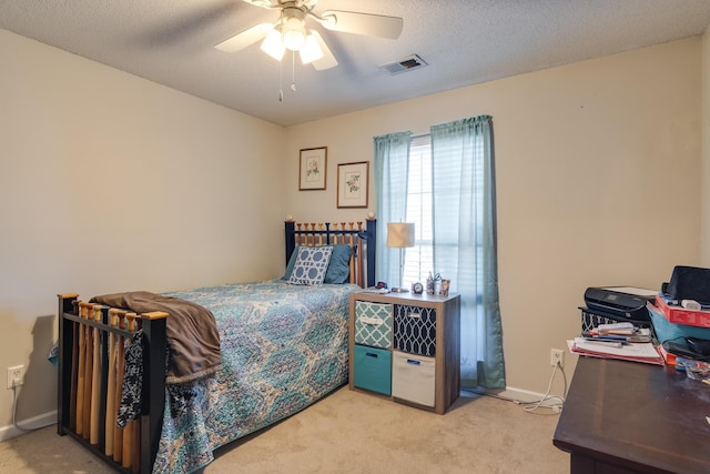 9995 Woodland Birch Dr, Lakeland, TN 38002 - bedroom with visible vents, light carpet, a ceiling fan, a textured ceiling, and baseboards
