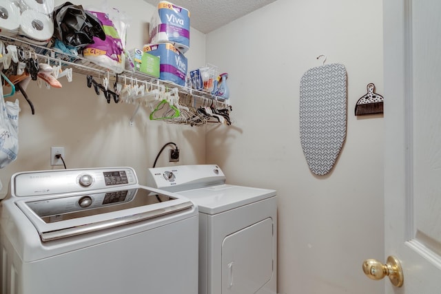 9995 Woodland Birch Dr, Lakeland, TN 38002 - clothes washing area featuring a textured ceiling, laundry area, and washing machine and clothes dryer