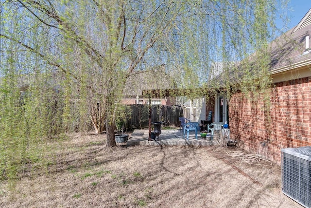 9995 Woodland Birch Dr, Lakeland, TN 38002 - view of yard featuring a patio area, central air condition unit, and fence