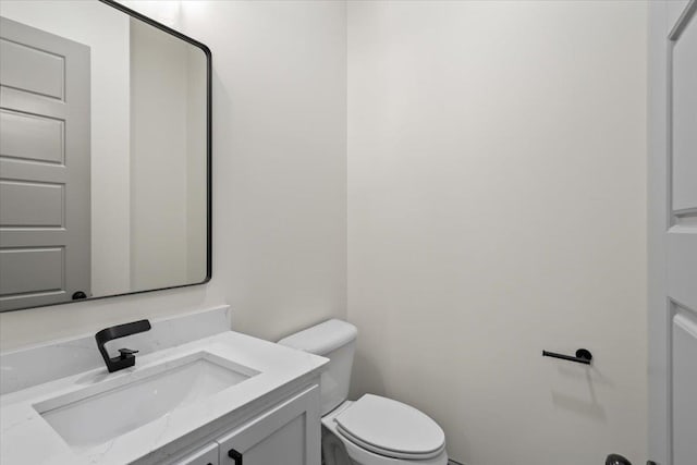 half bath with toilet and vanity