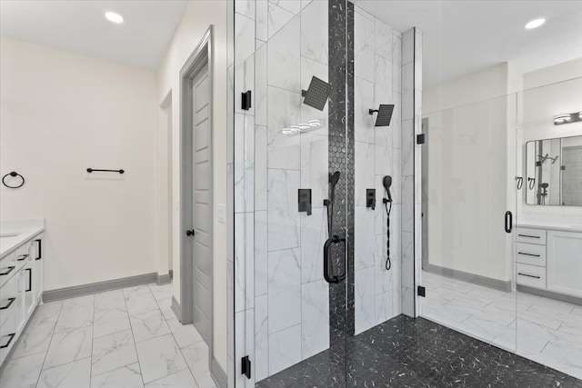 full bath featuring marble finish floor, recessed lighting, vanity, and a stall shower