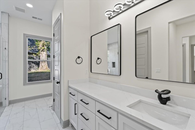 full bath featuring visible vents, marble finish floor, baseboards, and vanity