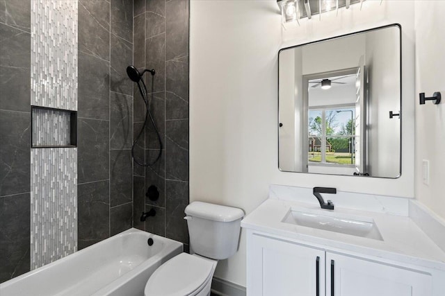 bathroom featuring shower / bathing tub combination, toilet, vanity, and ceiling fan