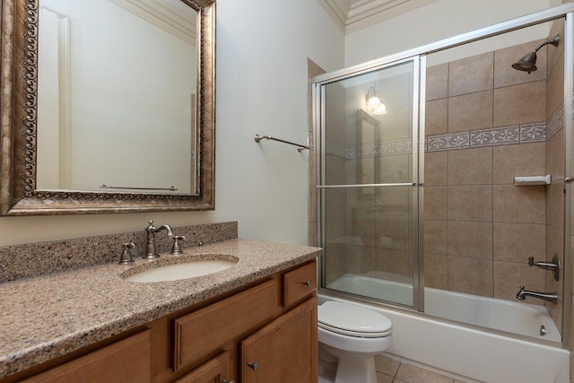 full bathroom with toilet, shower / bath combination with glass door, crown molding, tile patterned flooring, and vanity