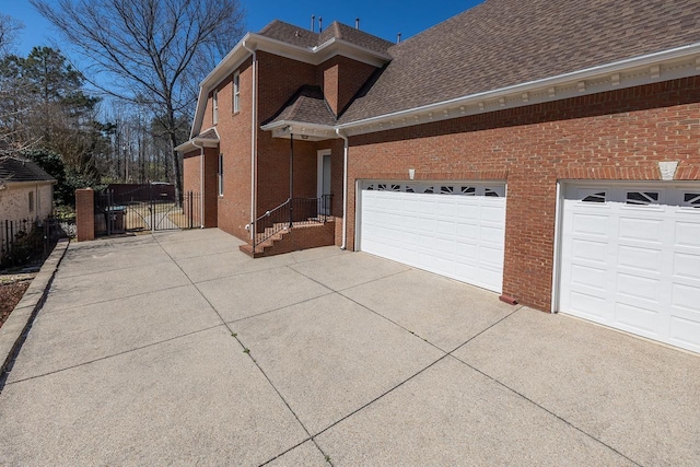 2793 Bayhill Woods Dr, Collierville, TN 38017 - view of home's exterior with driveway, brick siding, and a shingled roof