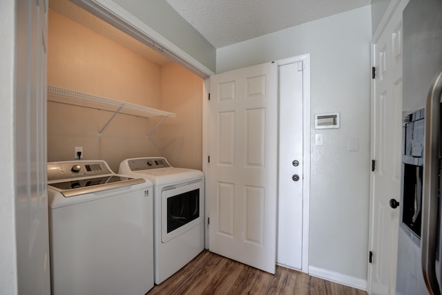 12065 Hidden Trl, Arlington, TN 38002 - washroom featuring laundry area, wood finished floors, independent washer and dryer, and a textured ceiling