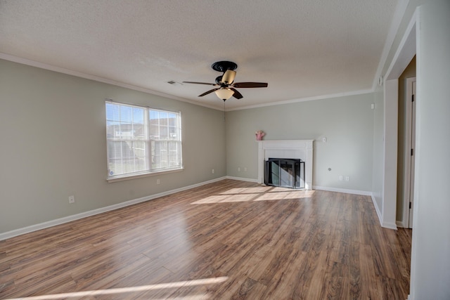 12065 Hidden Trl, Arlington, TN 38002 - unfurnished living room with visible vents, a textured ceiling, a ceiling fan, and wood finished floors