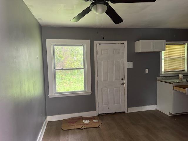3133 Morningside St, Memphis, TN 38127 - entrance foyer with baseboards, dark wood-style floors, and a ceiling fan