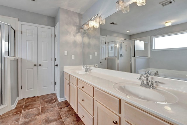full bathroom with a sink, visible vents, and a stall shower