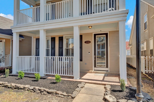 view of exterior entry featuring a porch