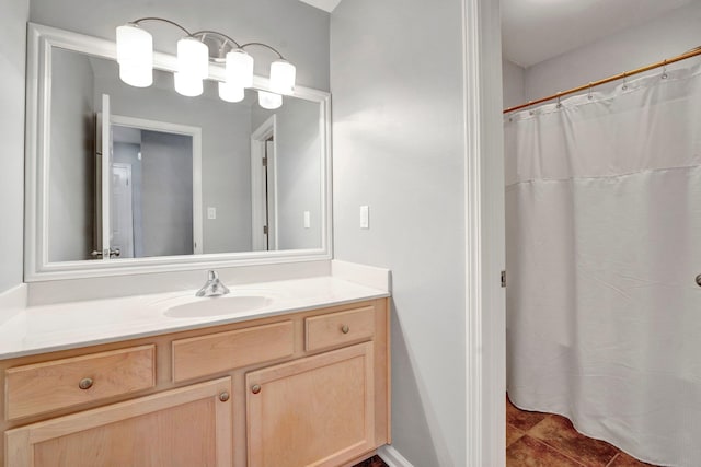 bathroom featuring tile patterned flooring, curtained shower, and vanity