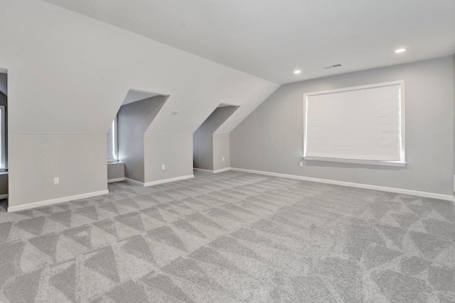 bonus room featuring visible vents, recessed lighting, baseboards, carpet, and lofted ceiling