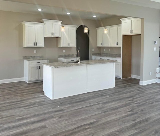 9738 Ryder Springs Dr, Cordova, TN 38018 - kitchen with baseboards, a sink, a kitchen island with sink, white cabinets, and recessed lighting