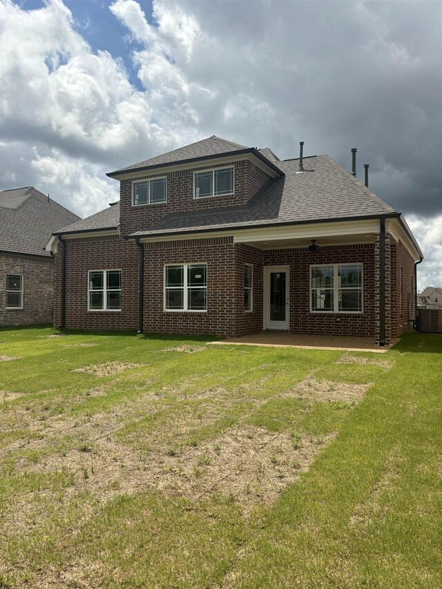 9738 Ryder Springs Dr, Cordova, TN 38018 - rear view of property with central AC, brick siding, and a lawn
