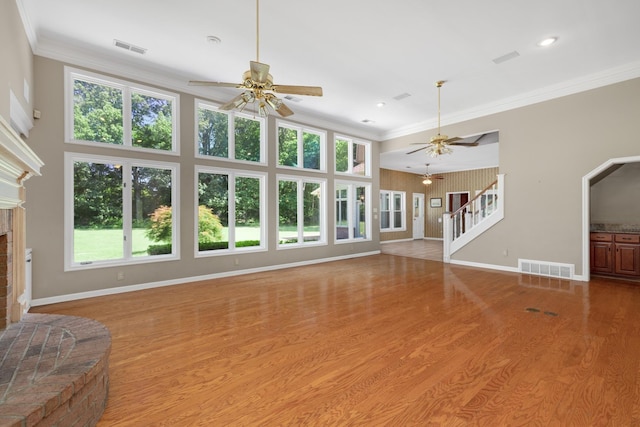 7570 Chapel Ridge Dr, Memphis, TN 38016 - unfurnished living room with visible vents, ceiling fan, and a fireplace