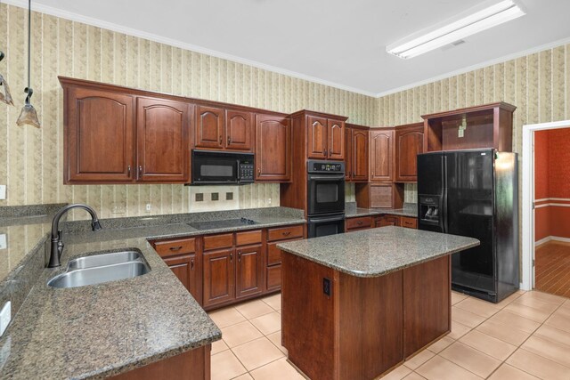 7570 Chapel Ridge Dr, Memphis, TN 38016 - kitchen featuring wallpapered walls, a center island, light tile patterned floors, black appliances, and a sink