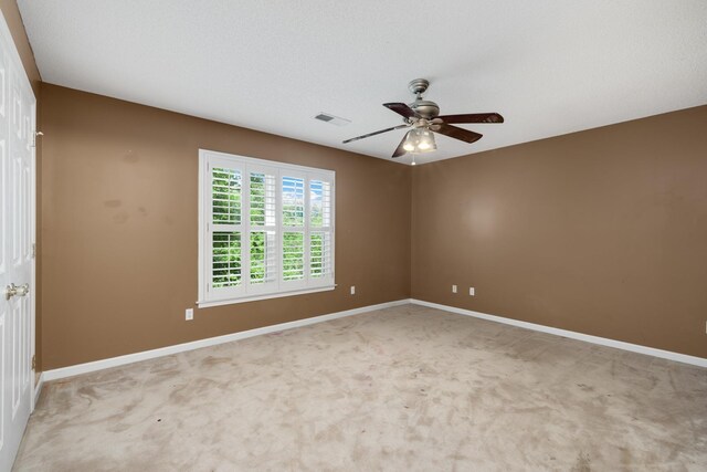 7570 Chapel Ridge Dr, Memphis, TN 38016 - empty room featuring visible vents, light carpet, baseboards, and a ceiling fan