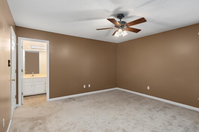 7570 Chapel Ridge Dr, Memphis, TN 38016 - unfurnished bedroom featuring a ceiling fan, baseboards, a sink, a textured ceiling, and light carpet