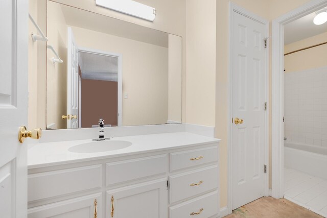 7570 Chapel Ridge Dr, Memphis, TN 38016 - bathroom with washtub / shower combination, vanity, and tile patterned flooring