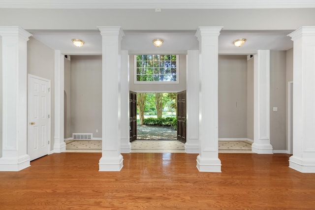7570 Chapel Ridge Dr, Memphis, TN 38016 - foyer featuring visible vents, decorative columns, baseboards, and wood finished floors