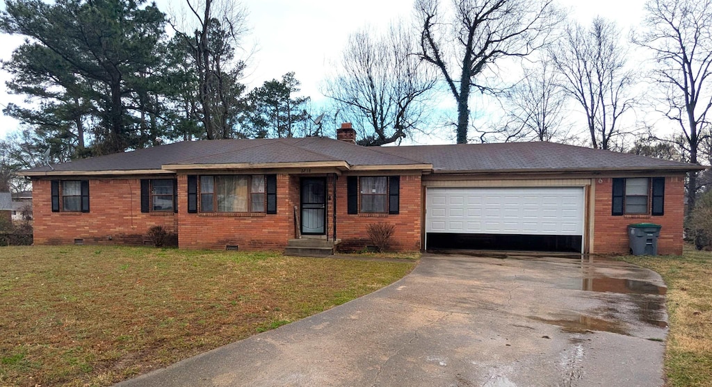 ranch-style house with a front yard, a chimney, a garage, crawl space, and driveway