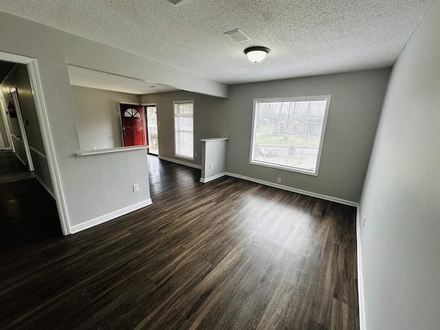 2260 Verse Cv, Memphis, TN 38127 - spare room featuring baseboards, dark wood-style flooring, and a textured ceiling