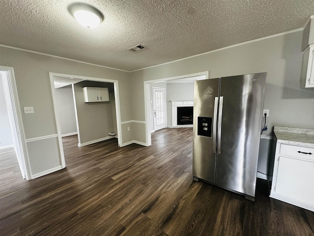 2260 Verse Cv, Memphis, TN 38127 - kitchen with dark wood-style floors, visible vents, stainless steel fridge with ice dispenser, ornamental molding, and white cabinets