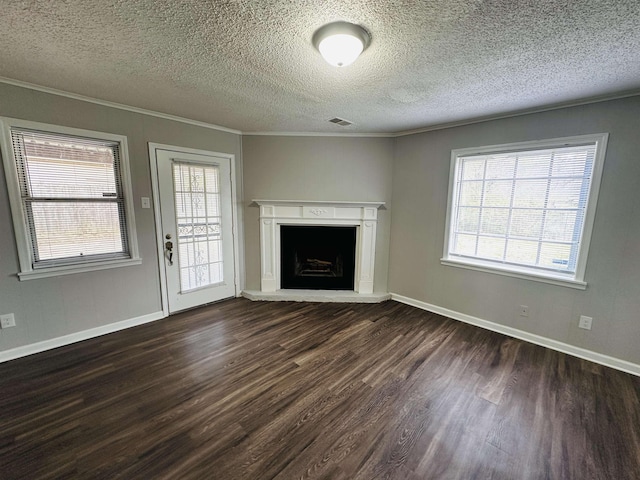 2260 Verse Cv, Memphis, TN 38127 - unfurnished living room featuring dark wood finished floors, plenty of natural light, visible vents, and ornamental molding