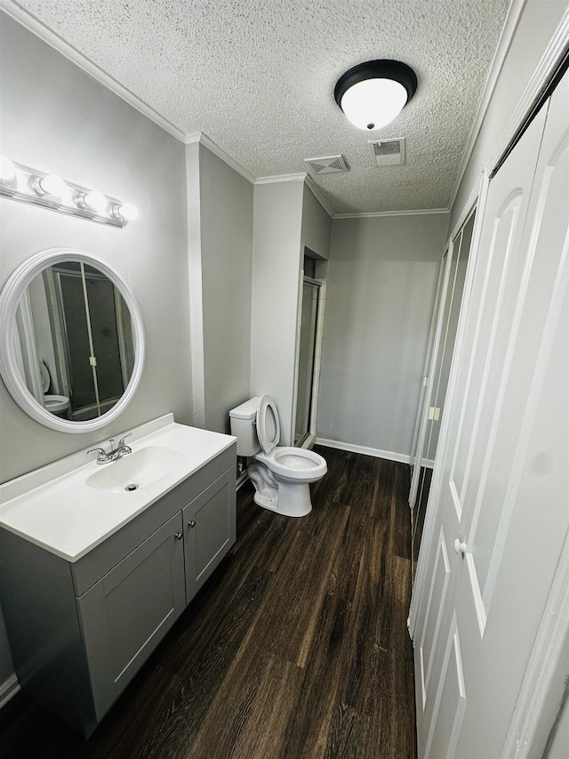 2260 Verse Cv, Memphis, TN 38127 - full bath featuring visible vents, crown molding, toilet, a stall shower, and wood finished floors