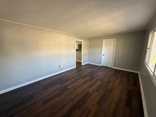 3617 Millington Rd, Memphis, TN 38127 - unfurnished room featuring ornamental molding, dark wood-style floors, baseboards, and a textured ceiling