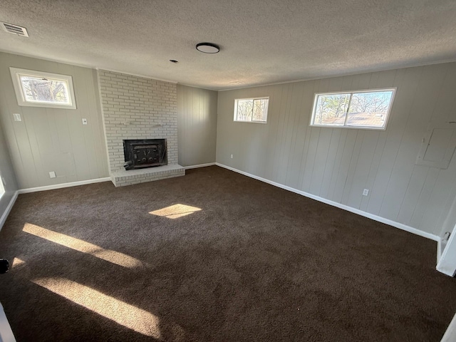 3617 Millington Rd, Memphis, TN 38127 - unfurnished living room featuring visible vents, plenty of natural light, and dark colored carpet