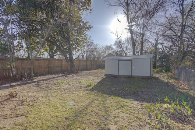 1131 Rozelle St, Memphis, TN 38106 - view of yard with a fenced backyard, an outdoor structure, and a storage shed