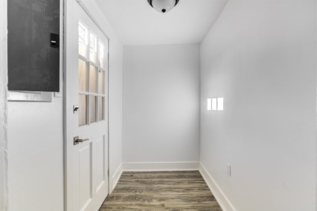 1131 Rozelle St, Memphis, TN 38106 - doorway with baseboards and dark wood-style flooring