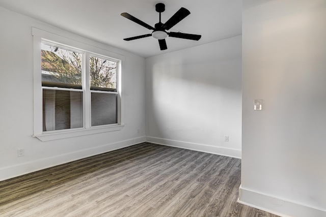 1131 Rozelle St, Memphis, TN 38106 - empty room with baseboards, wood finished floors, and ceiling fan