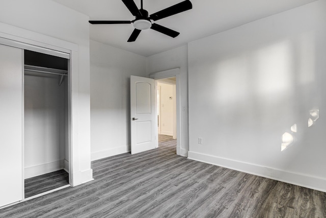 1131 Rozelle St, Memphis, TN 38106 - unfurnished bedroom featuring baseboards, wood finished floors, a closet, and a ceiling fan