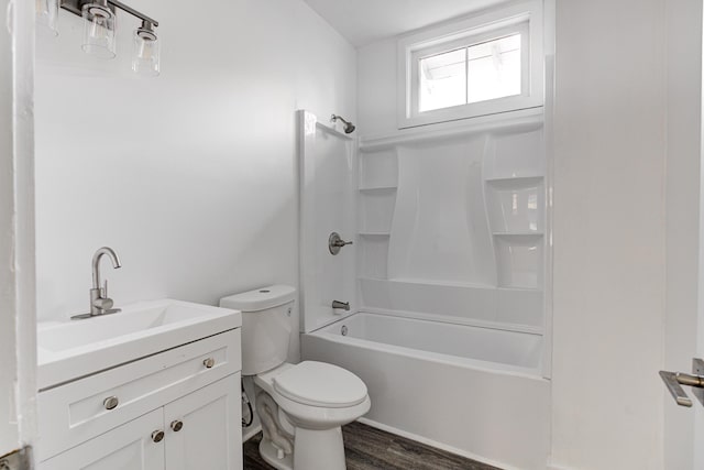 1131 Rozelle St, Memphis, TN 38106 - bathroom with washtub / shower combination, wood finished floors, toilet, and vanity
