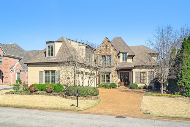 view of front of property with roof with shingles and french doors