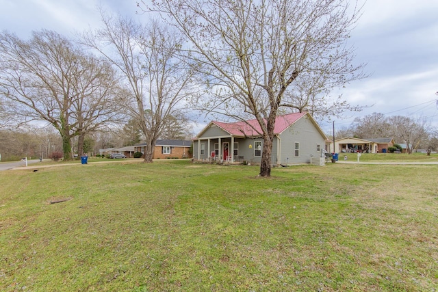 view of yard featuring covered porch