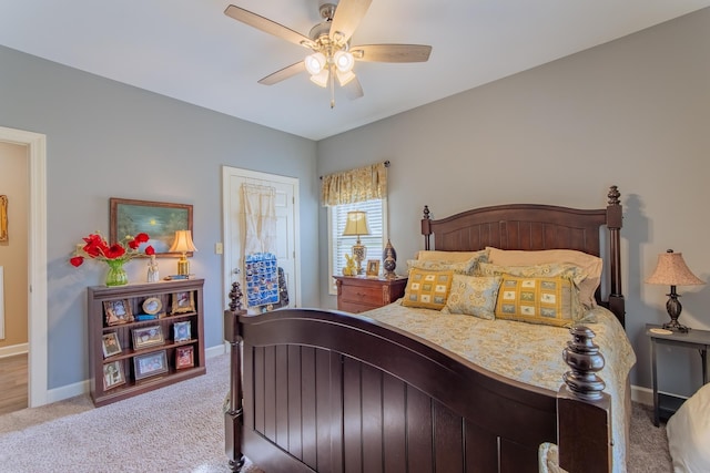 bedroom with baseboards, carpet floors, and a ceiling fan